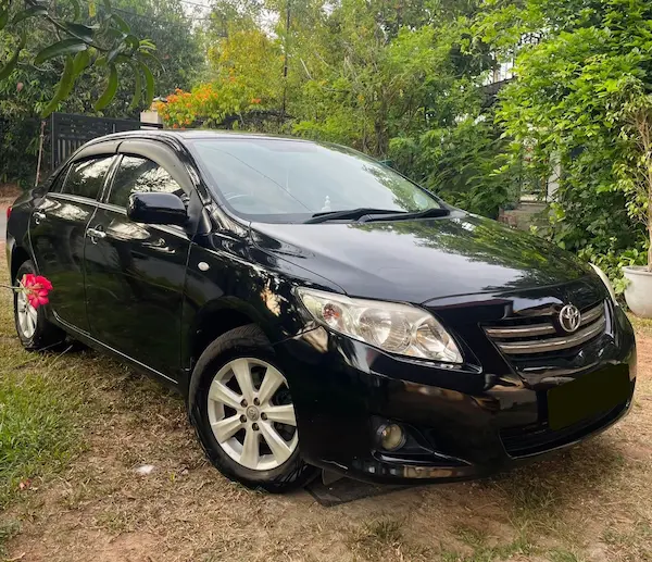 Black Toyota Corolla and black Toyota Prius sedan cars with private driver in Sri Lanka